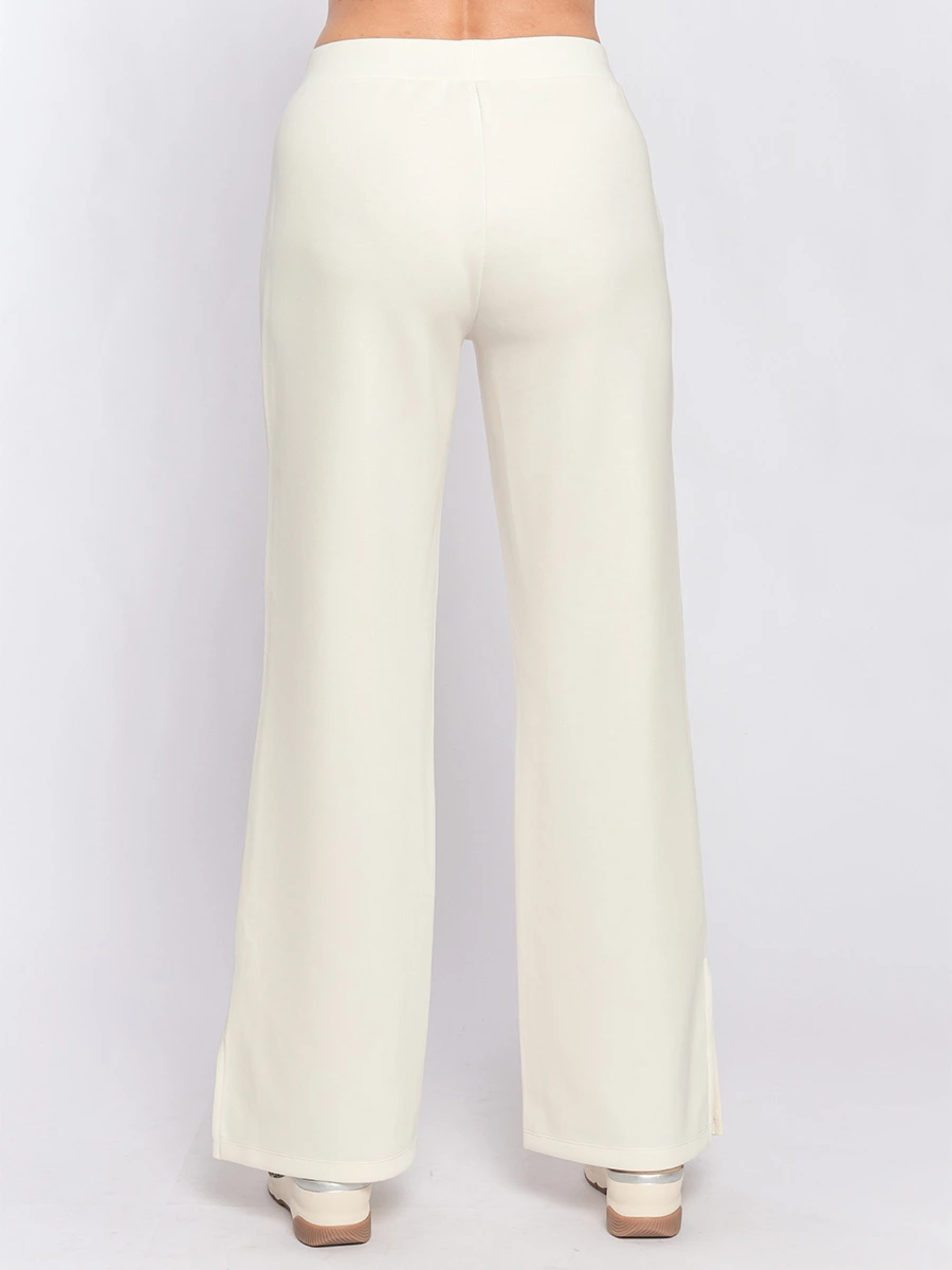 Расклешенные молочно-белые брюки